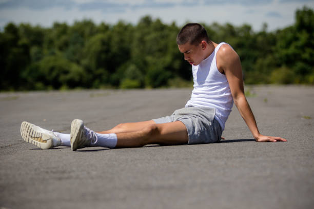 istock A Nineteen Year Old Teenage Boy Doing Situps In A Public Park 1410839739