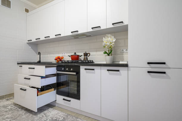 istock Trendy white modern kitchen interior with minimalistic furniture 1410843039