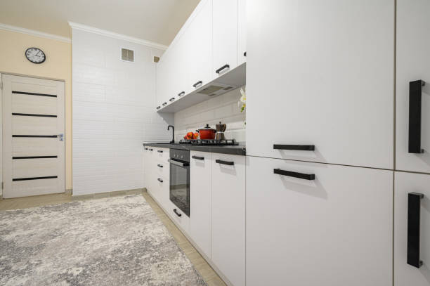 istock Trendy white modern kitchen interior with minimalistic furniture 1410843044
