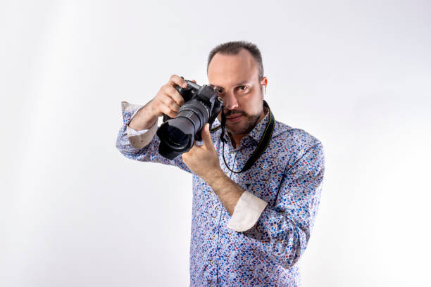 istock Hipster Man With Reflex Camera and Earphones 1410844690