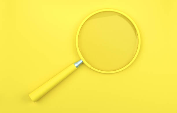 istock Yellow magnifying glass on the yellow background. 1410846529