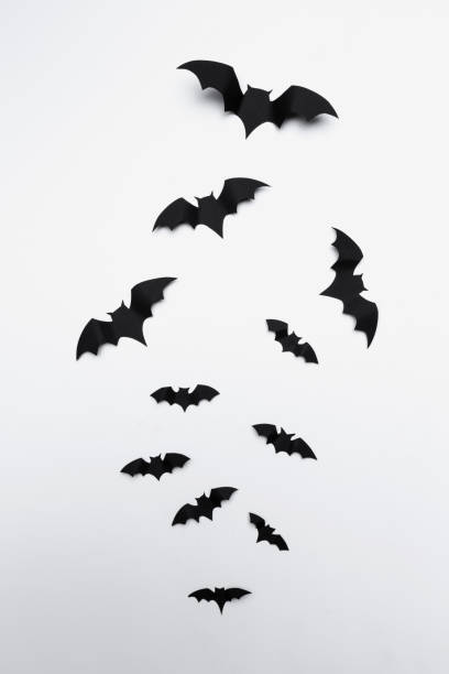 istock halloween and decoration concept - paper bats flying 1410846809