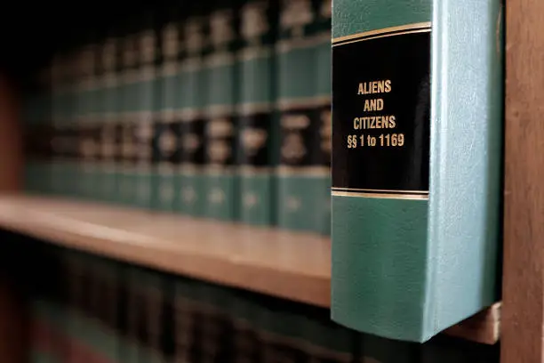 Lawbooks on shelf title for study legal knowledge Aliens and citizens