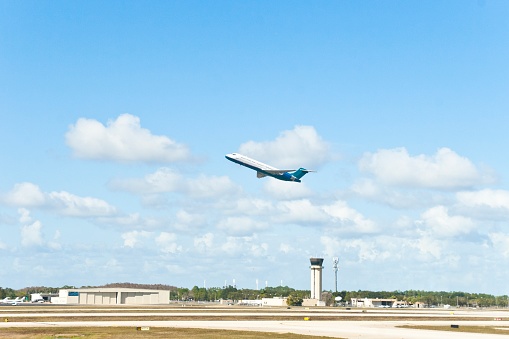 Plane taking off at Fort Myers International Airport in Florida, USA. This image is part of a series.