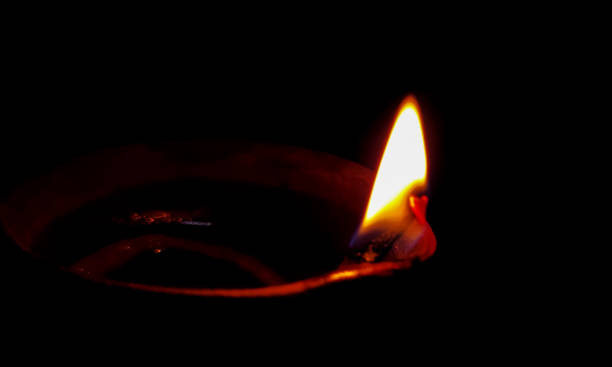 istock Traditional oil lamp on dark background with copy space. 1410850894