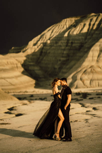 istock Couple Shooting With Black Dresses 1410852172