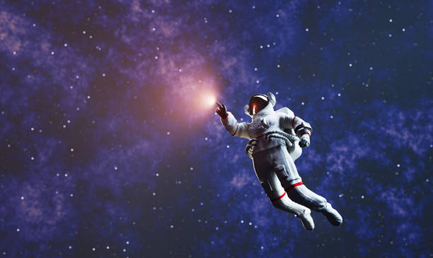 istock Astronaut spacewalk in space and touching orb of light. 1410857764