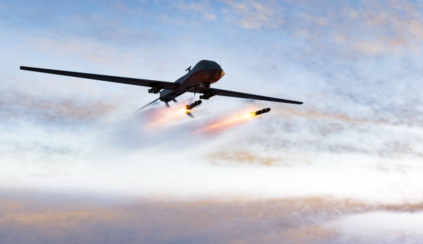 Military combat drone UAV launching missiles stock photo