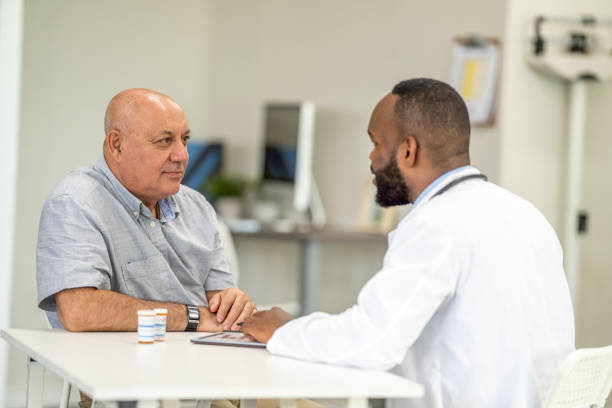 istock Doctor Talking About Medications with a Senior 1410859609
