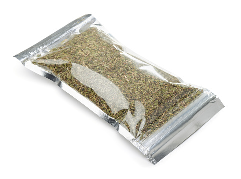 Plastic bag of  herb and spice mix isolated on white
