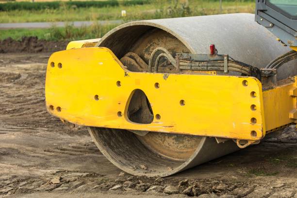 istock Heavy Vibration roller at compaction pavement works during road repairing. Construction of a new road. Compaction road roller. Construction works. 1410864454