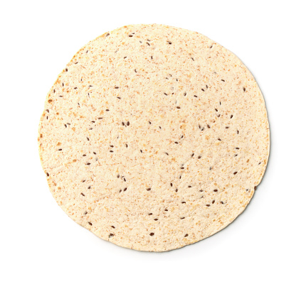 Top view of multigrain tortilla isolated on white