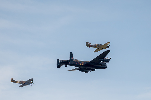 Fairford, UK - July 17th 2022: Spitfire, Lancaster and Hurricane of the RAF Battle of Britain Memorial Flight on a fly past
