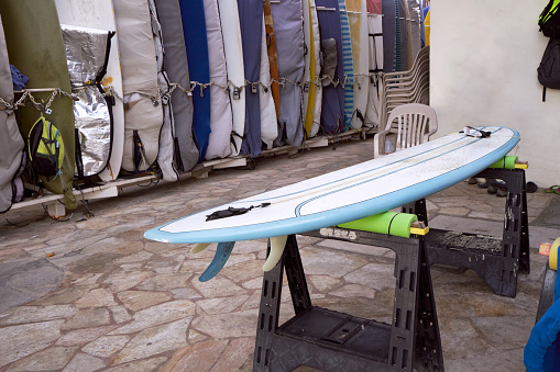 Surfboard storage racks on Waikiki Beach on the island of Oahu, Hawaii. Waxed and ready to go.