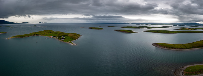 panorama landscape of the sunken drumlin islands of Clew Bay in County Mayo of western Ireland under an overcast sky