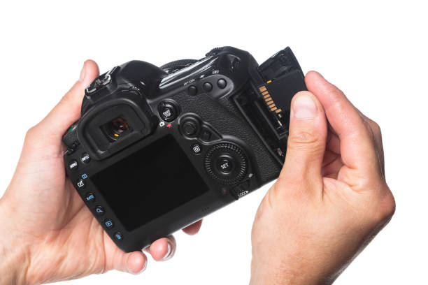 istock Photo camera in hand isolated on white background 1410867949