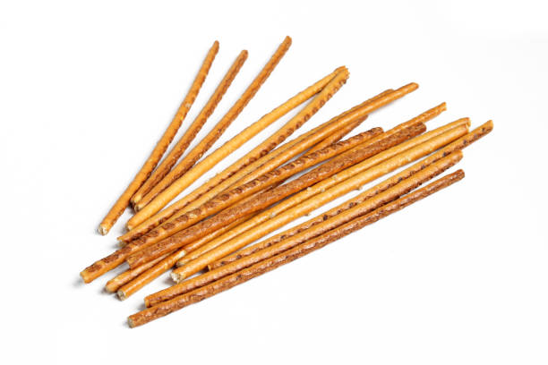 istock Pile of pretzel sticks isolated on white background 1410868378