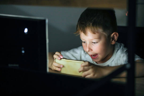 istock Myopia Symptoms, Child Plays Video Game With Phone 1410870112