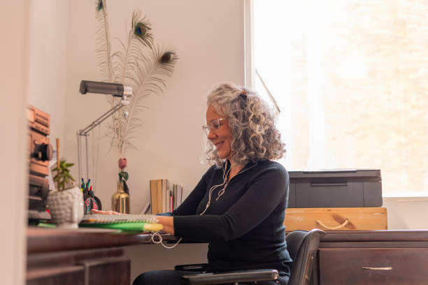 istock beautiful older woman receives classes in virtual mode 1410870993