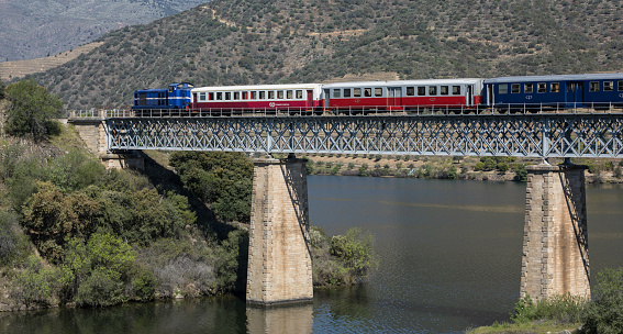 Aerial View of train passing through the mountains