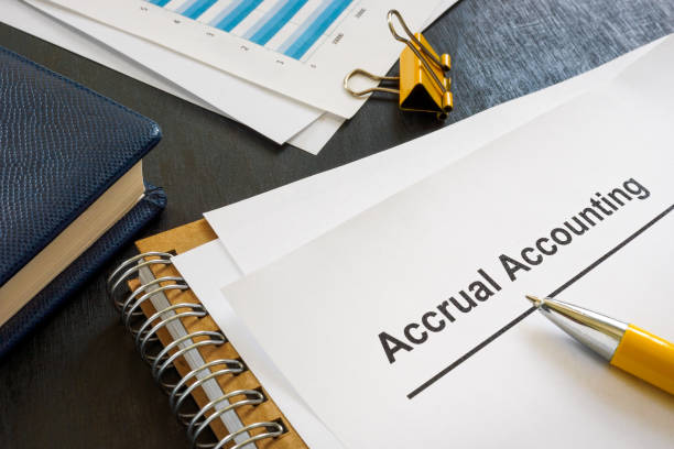 istock Documents about accrual accounting near notepad and pen. 1410875743
