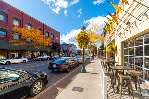 Sherman Avenue, the main street of shops and cafes through the lakeside small town of Coeur d'Alene, Idaho, in the Idaho panhandle at autumn.