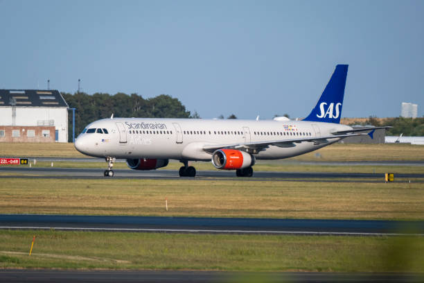 Airbus A321, operated by Scandinavian Airlines System SAS,  taking off from the Copenhagen airport CPH. Registration OY-KBE stock photo