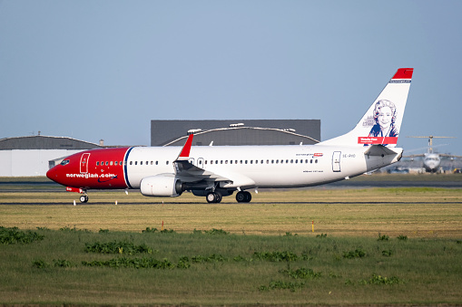 Copenhagen / DENMARK - JULY 22, 2022: A Boeing 737-800 , operated by Norwegian Air Shuttle, taxiing at the Copenhagen airport CPH. Registration SE-RXO with Wenche Foss livery