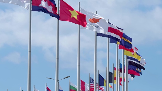 International Congress, many flags of different countries on flagpoles in the open air