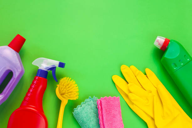 istock Colorful cleaning set for different surfaces in kitchen, bathroom and other rooms. Empty place for text or logo on isolated background. Cleaning service concept. Early spring regular clean up. 1410879028