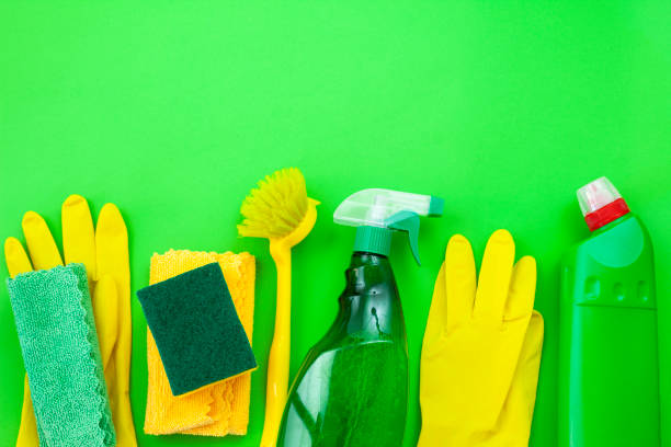 istock Colorful cleaning set for different surfaces in kitchen, bathroom and other rooms. Empty place for text or logo on isolated background. Cleaning service concept. Early spring regular clean up. 1410879030