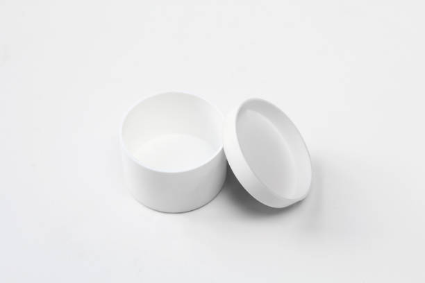 istock Plastic and empty white box on white background. Small,opened packaging mockup for medicine. Round design 1410880087