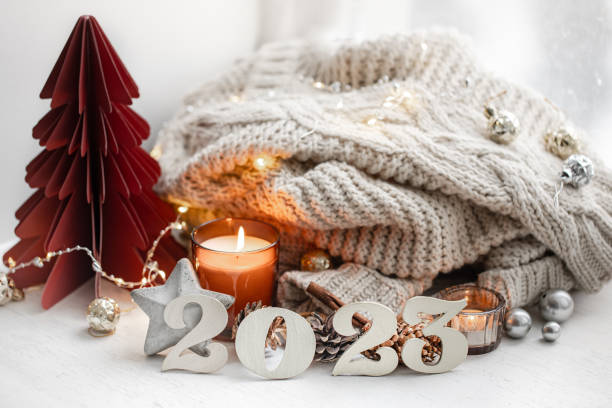 istock Christmas background with decorative numbers 2023 and cozy details. 1410880753