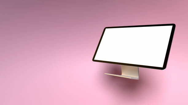 Back to School and business concept with an empty desktop computer on pink and coral background. Educational concept with copy space. Easy to crop for all your design and print needs.