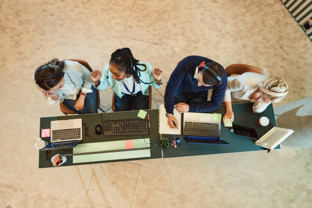 istock High angle view of group of customer service representatives working in a call center 1410883695