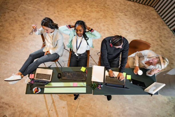 istock High angle view of group of customer service representatives working in a call center 1410883696
