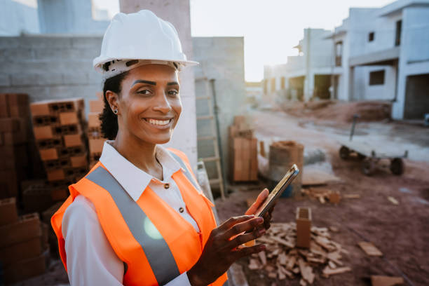 portrait of a woman at the construction site stock photo