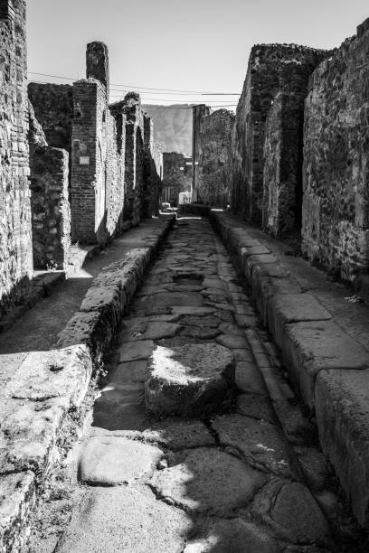 A crosswalk of a typical Roman road in the ancient city of Pompeii, Italy A crosswalk of a typical Roman road in the ancient city of Pompeii, Southern Italy 2632 stock pictures, royalty-free photos & images