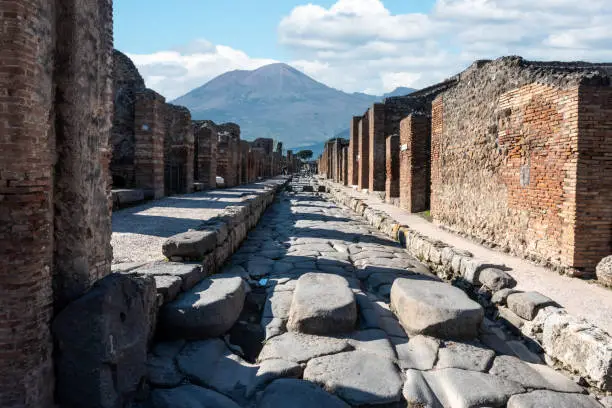Photo of A crosswalk of a typical Roman road in the ancient city of Pompeii, Italy