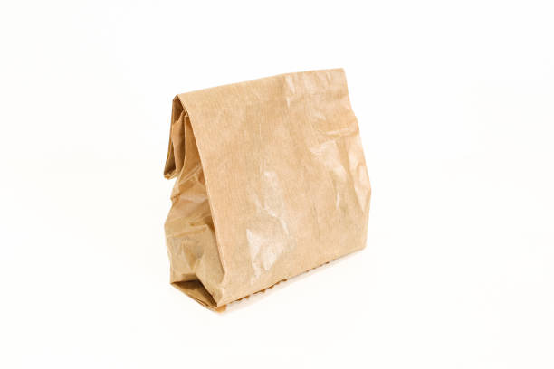 istock Small paper bag isolated on white background. Grocery bag 1410885207