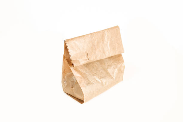 istock Small paper bag isolated on white background. Grocery bag 1410885210