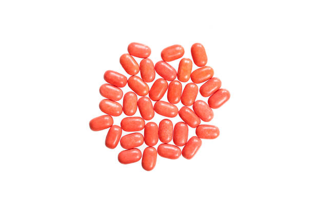 istock Top view of red mint candy pills. Isolated on white background 1410886198