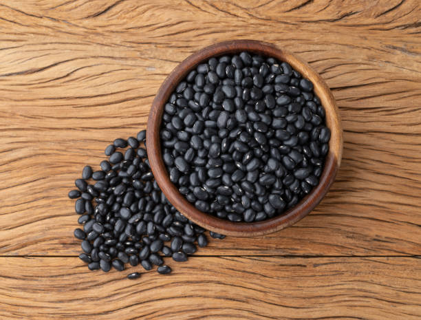 istock Black beans in a bowl over wooden table 1410887743