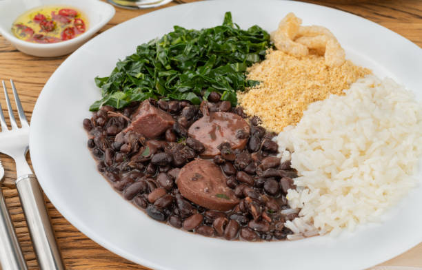 istock Typical brazilian feijoada with rice, pepper, farofa, kale and cracklings 1410887818