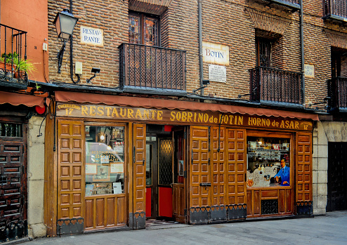Madrid, Spain - May 2018: The worlds oldest restaurant, as recognized by Guinness World Records. It is called Sobrino de Botin and was founded in 1725.