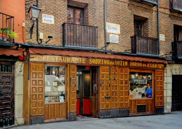 Nephew of Botin Restaurant Madrid, Spain - May 2018: The worlds oldest restaurant, as recognized by Guinness World Records. It is called Sobrino de Botin and was founded in 1725. berk stock pictures, royalty-free photos & images