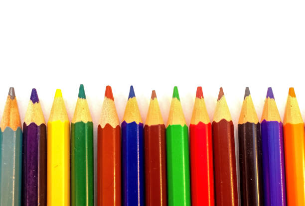 istock Color pencils in a row group isolated on white 1410887884
