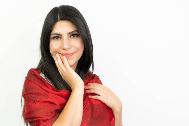 istock middle eastern woman with red scarf, white background 1410890942