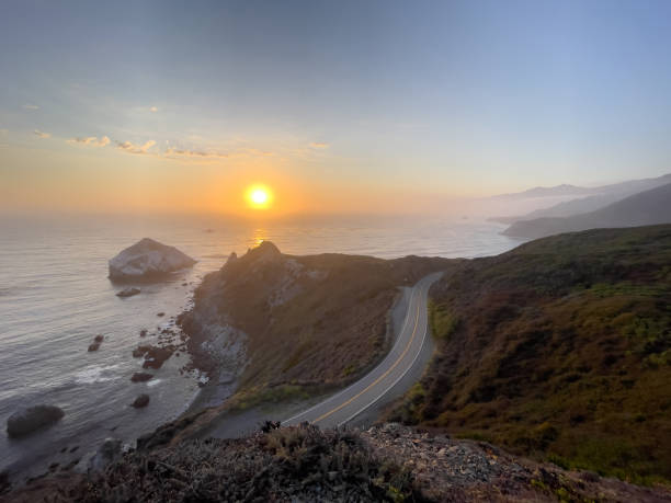 istock Golden sunset over State Route 1, on the Pacific Ocean. Pacific Coast Highway, Central California near Gorda 1410891460