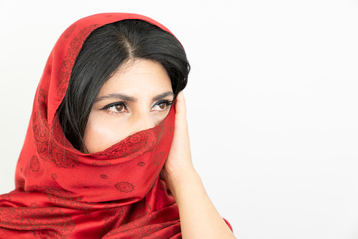 middle eastern woman with red scarf, white background